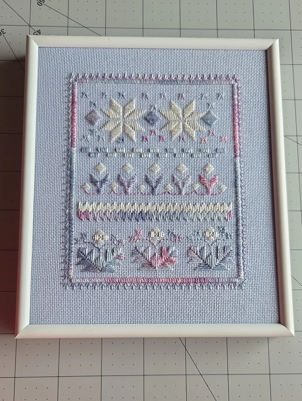 Hand-Embroidered Floral Cross Stitch Wall Art in Pastel Colors